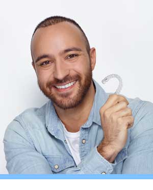 Cost of Invisalign interior photo man with bracket Elite Orthodontics San Diego CA